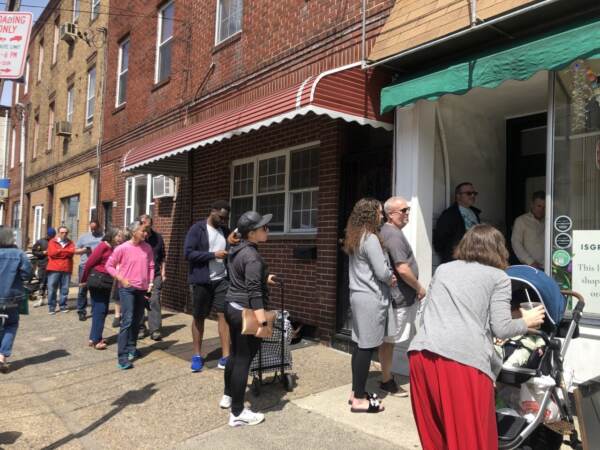 The line was down the block outside Isgro’s Pastries in South Philadelphia on Saturday afternoon. Many were shopping for their Easter specialties like ricotta pie. (Emily Rizzo/WHYY News)