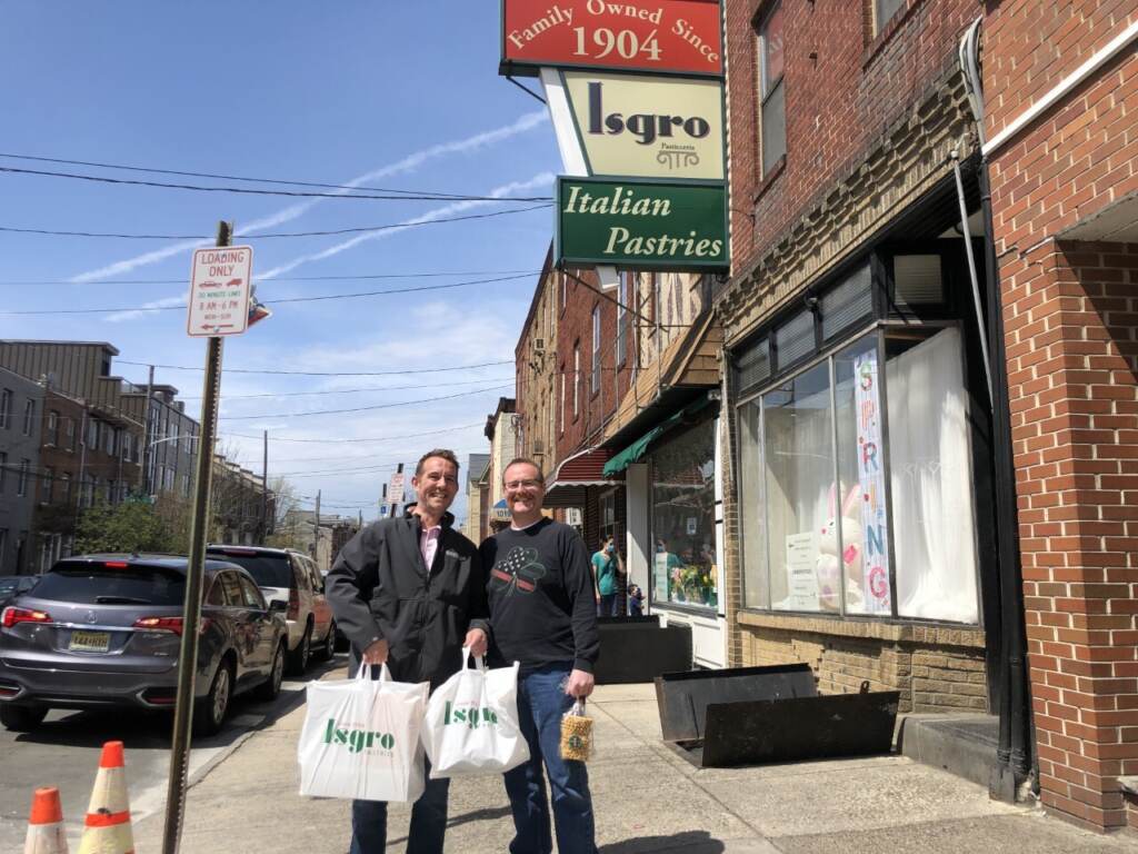 Steve Casar came straight from the airport with his brother to Isgro’s Pastries to pick up desert for Easter Sunday. (Emily Rizzo/WHYY News)
