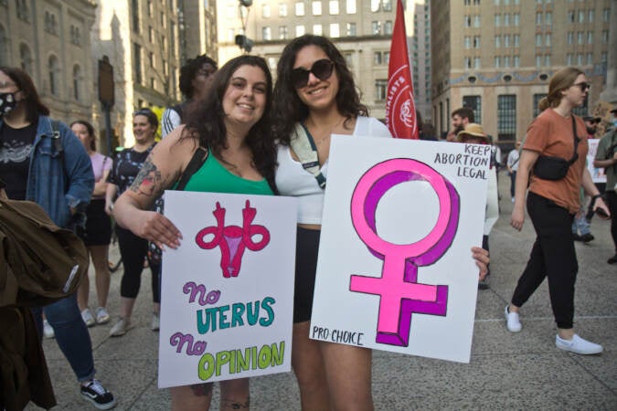 Skylar Ricci (left) and Courtney Dubi (right) rallied with about a thousand others for abortion rights outside City Hall in Philadelphia on May 3, 2022. (Kimberly Paynter/WHYY)