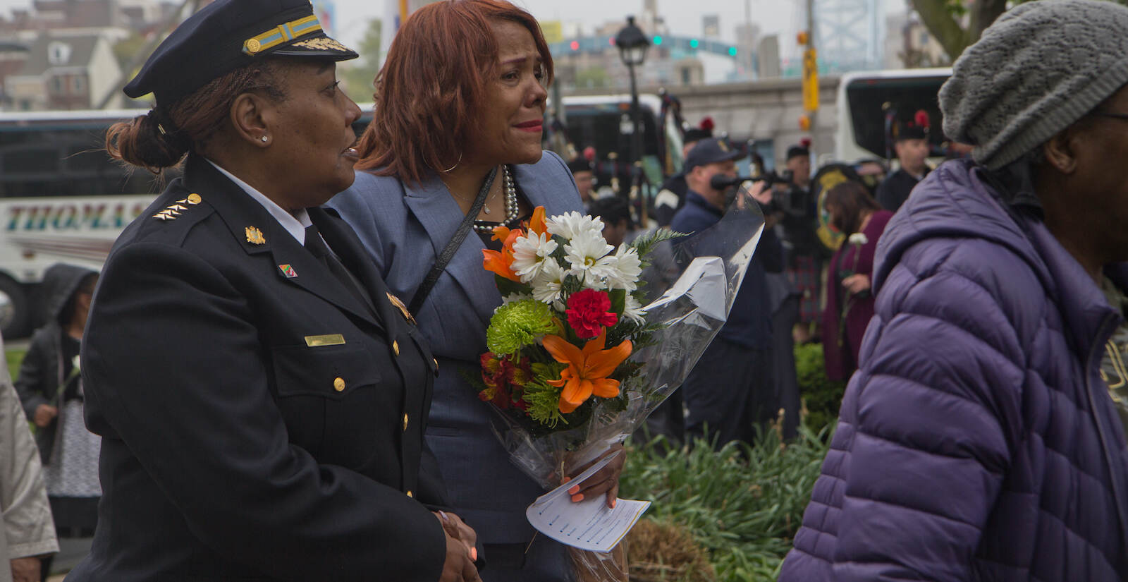 Family members of fallen police officers and firefighters in Philadelphia grieved the loss of their loved ones at the Living Flame Memorial Service on May 4, 2022. (Kimberly Paynter/WHYY)