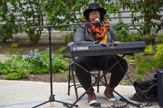 Kendra Butler-Waters from the Philadelphia Clef Club of Jazz and Performing Arts played “What a Wonderful World” at the #fundPHLarts rally outside City Hall in Philadelphia on May 11, 2022. (Kimberly Paynter/WHYY)