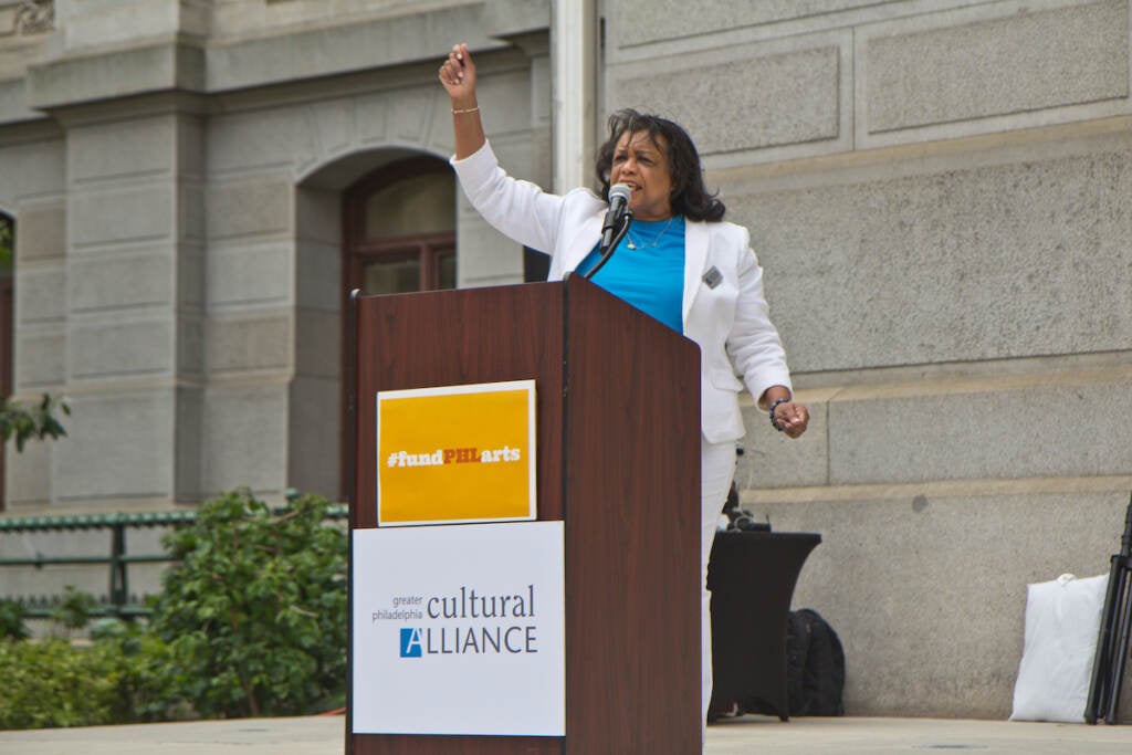 Patricia Wilson Aden speaks at a podium.