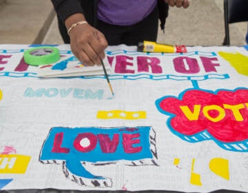 An art project is seen with the words ''vote'' and ''love'' visible