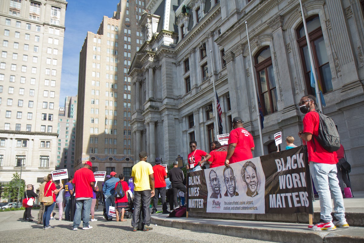 The Labor for Black Lives Coalition held a vigil for George Floyd on the two-year anniversary of his murder outside City Hall in Philadelphia on May 25, 2022. (Kimberly Paynter/WHYY)