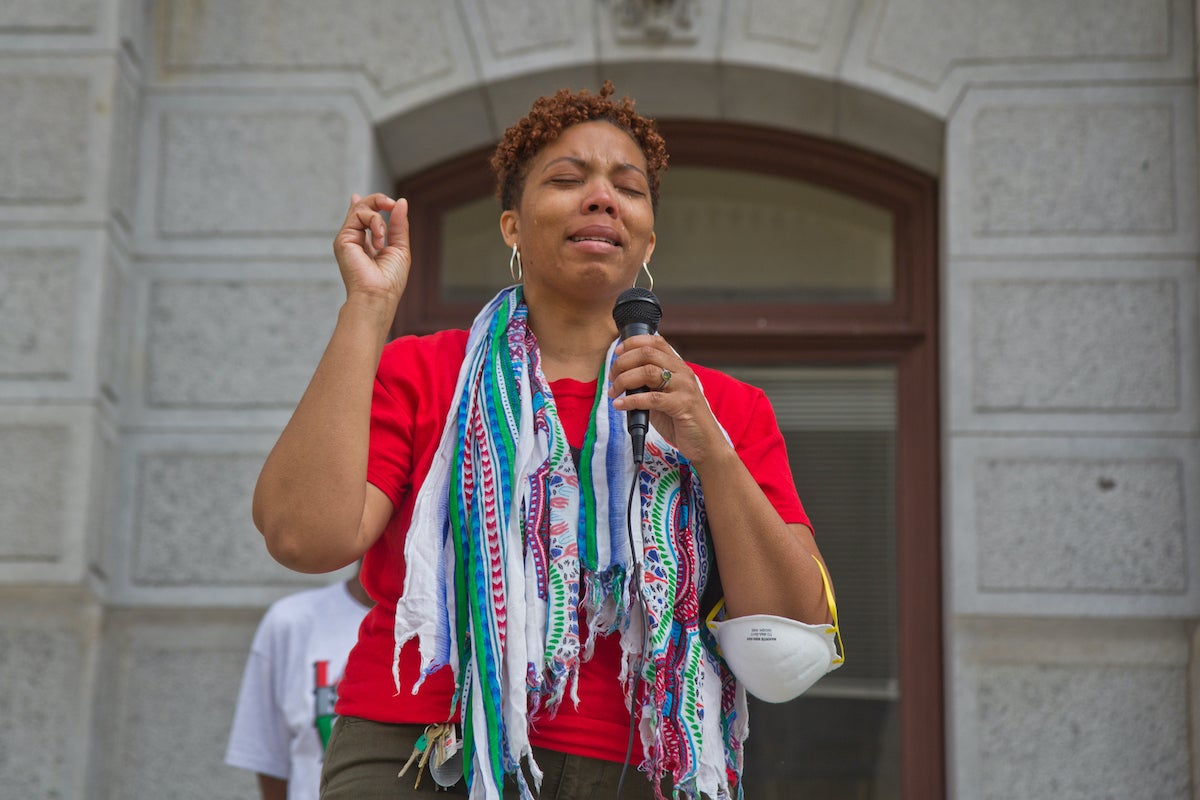 Sheri Davis-Faulkner, a mother, an assistant professor at Rutgers University and part of the new Philadelphia Black Workers Center Project, said she spent the day outside her son’s school because it made her feel better to be close to him, at the Labor for Black Lives Coalition vigil for George Floyd outside City Hall in Philadelphia on May 25, 2022. (Kimberly Paynter/WHYY)