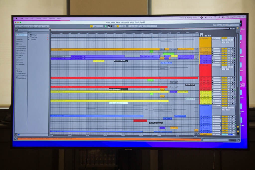 A screen shows a sound programming software.