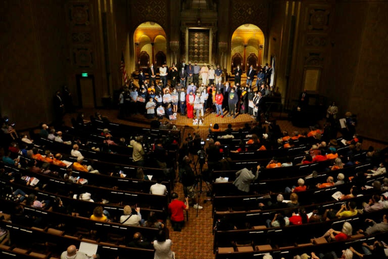 Activists, politicians, and faith leaders gather for a rally at Congregation Rodeph Shalom in Philadelphia, calling for legislators to act to stop gun violence. (Emma Lee/WHYY)