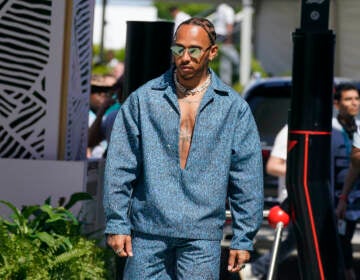 Mercedes driver Lewis Hamilton of Britain arrives at the Formula One Miami Grand Prix auto race at Miami International Autodrome, Friday, May 6, 2022, in  Miami Gardens, Fla. (AP Photo/Darron Cummings)