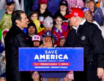 Pennsylvania Senate candidate Mehmet Oz, left, accompanied by former President Donald Trump, speaks at a campaign rally in Greensburg, Pa., Friday, May 6, 2022. (AP Photo/Gene J. Puskar)