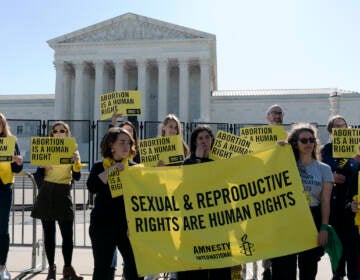 Abortion rights activists protest outside of the U.S. Supreme Court, Wednesday, May 11, 2022 in Washington. A draft opinion suggests the U.S. Supreme Court could be poised to overturn the landmark 1973 Roe v. Wade case that legalized abortion nationwide, according to a Politico report