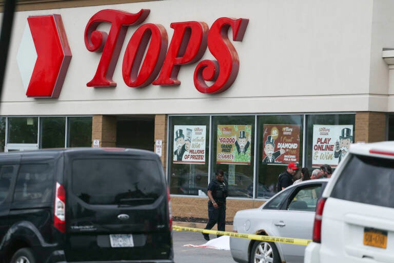 Police investigate after a shooting at a supermarket on Saturday, May 14, 2022, in Buffalo, N.Y.  (AP Photo/Joshua Bessex)