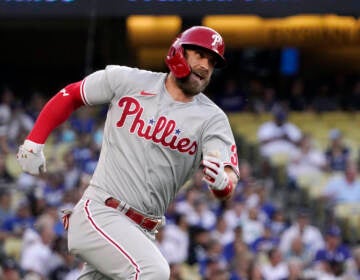 File photo: Philadelphia Phillies' Bryce Harper rounds first on his way to a double during the first inning of a baseball game against the Los Angeles Dodgers Saturday, May 14, 2022, in Los Angeles. (AP Photo/Mark J. Terrill)