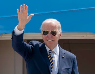 President Joe Biden waves as he boards Air Force One for a trip to South Korea and Japan, Thursday, May 19, 2022, at Andrews Air Force Base, Md. (AP Photo/Gemunu Amarasinghe)