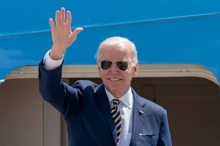 President Joe Biden waves as he boards Air Force One for a trip to South Korea and Japan, Thursday, May 19, 2022, at Andrews Air Force Base, Md. (AP Photo/Gemunu Amarasinghe)