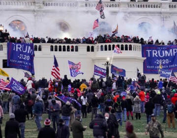 File photo: In this Jan. 6, 2021, file photo violent rioters, loyal to President Donald Trump, storm the Capitol in Washington. (AP Photo/John Minchillo, File)