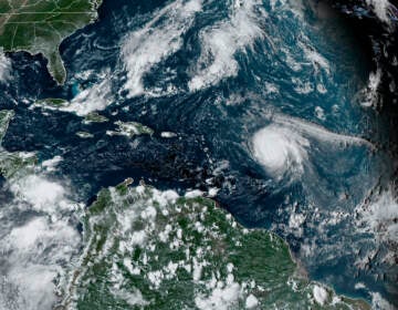 This satellite image provided by the National Oceanic and Atmospheric Administration shows Hurricane Sam, just right of center, in the Atlantic Ocean, Monday, Sept. 27, 2021, at 1920 Zulu (3:20 p.m. ET). (NOAA via AP)