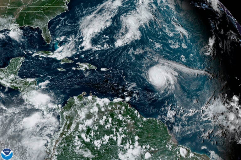 This satellite image provided by the National Oceanic and Atmospheric Administration shows Hurricane Sam, just right of center, in the Atlantic Ocean, Monday, Sept. 27, 2021, at 1920 Zulu (3:20 p.m. ET). (NOAA via AP)