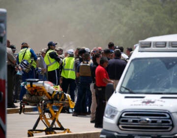 Emergency personnel gather near Robb Elementary School following a shooting