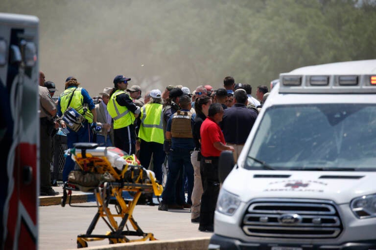 Emergency personnel gather near Robb Elementary School following a shooting