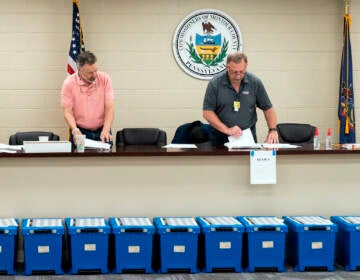 Election workers perform a recount of ballots from the recent primary election at the Montour County administration center in Danville, Pa., Friday, May 27, 2022. (AP Photo/Matt Rourke)