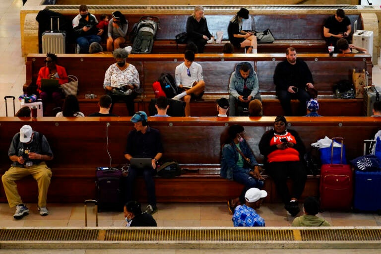 Travelers wait at 30th Street Station ahead of Memorial Day weekend, Friday, May 27, 2022, in Philadelphia, Pa. (AP Photo/Matt Slocum)