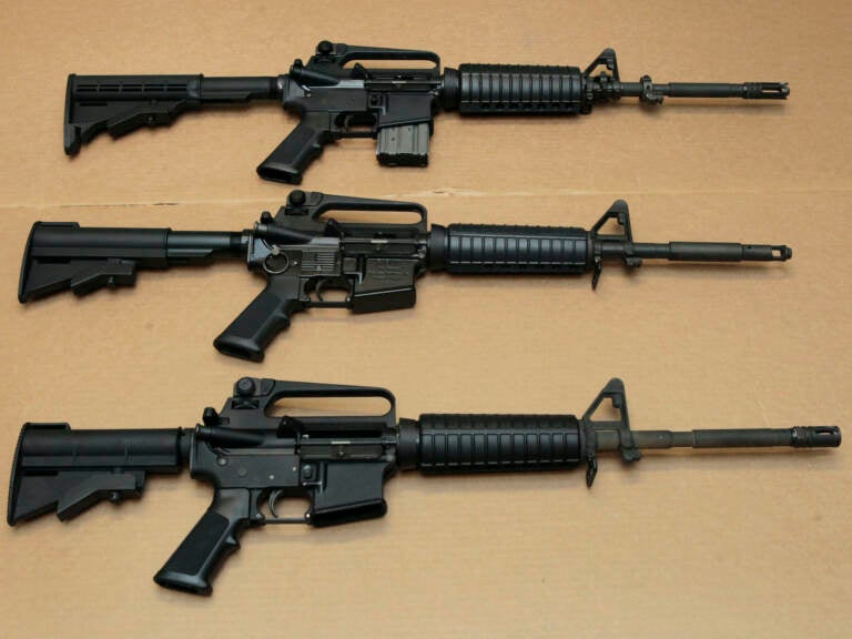 Three variations of the AR-15 assault rifle are displayed