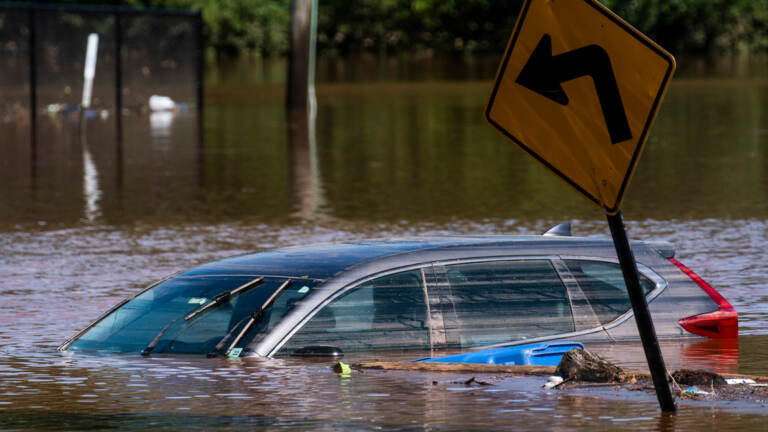 A car caught in a flooded road in Somerville in Tropical Storm Ida. (AP Photo/Eduardo Munoz Alvarez)