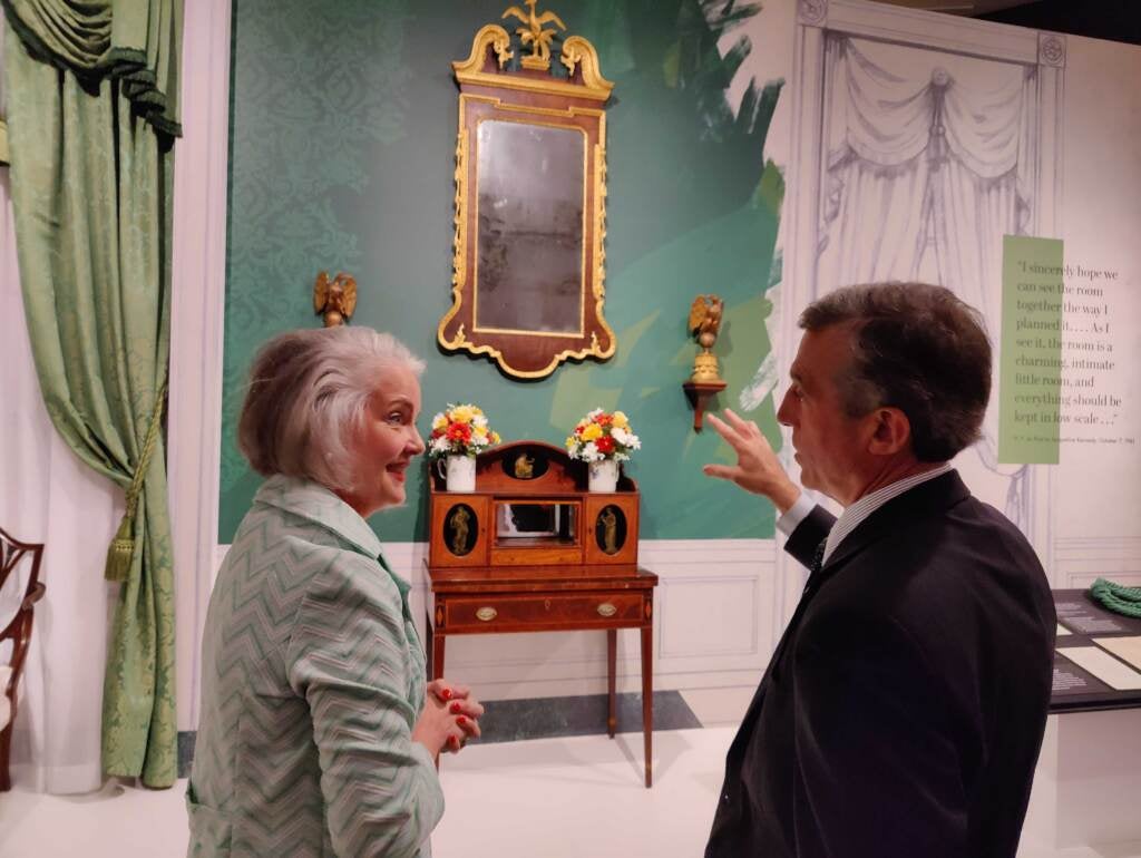 Curator Elaine Rice Bachmann shows a recreation of the White House Green Room to Delaware Gov. John Carney