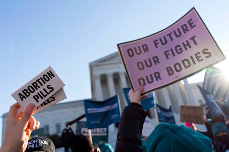 Abortion rights advocates demonstrate in front of the Supreme Court