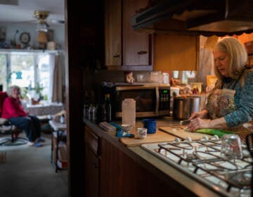 Nancy Rose cooks for her mom in their home