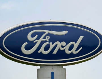 A Ford logo is seen on a sign at Country Ford in Graham, N.C. The auto manufacturer has issued a recall that affects about 39,000 SUVs. (Gerry Broome/AP)