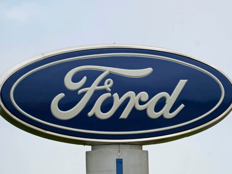 A Ford logo is seen on a sign at Country Ford in Graham, N.C. The auto manufacturer has issued a recall that affects about 39,000 SUVs. (Gerry Broome/AP)