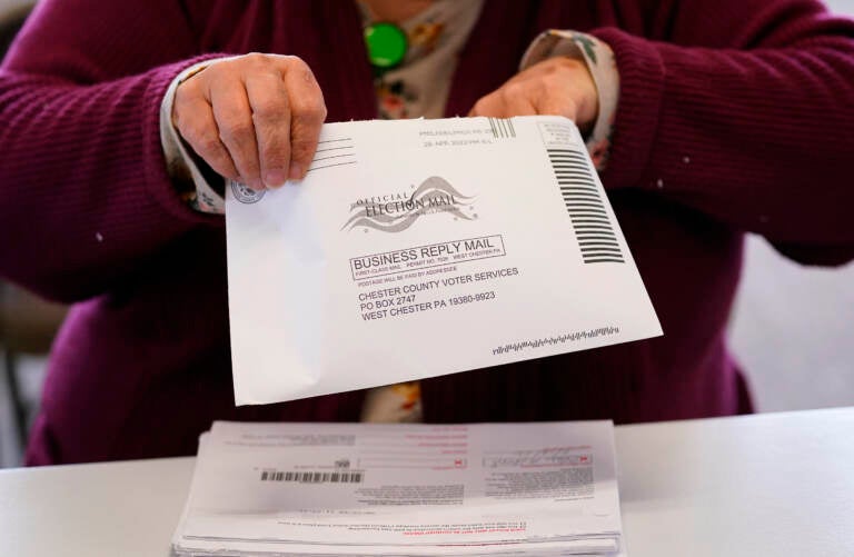 File photo: Election worker Monica Ging processes a ballot for Pennsylvania's primaries this month at the Chester County Voter Services office in West Chester, Pa. (Matt Slocum/AP)