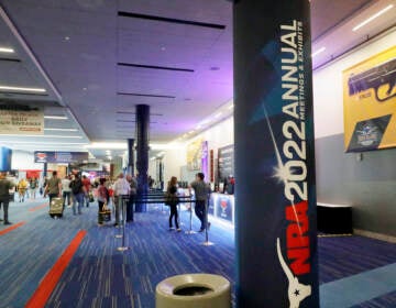 Attendees of the NRA's annual convention gather by booths in the exhibit halls of the George R. Brown Convention Center in Houston on Thursday. (Michael Wyke/AP)