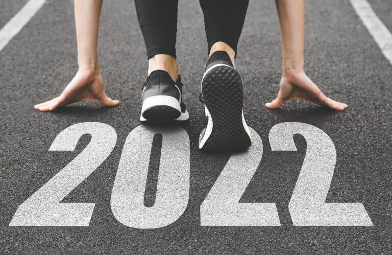 close-up of feet in sneakers at the start of the new year 2022