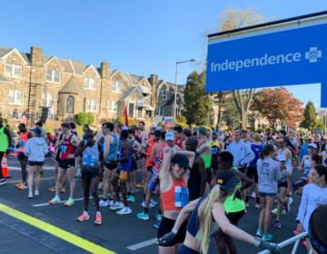 Runners stretch and prepare to race at the starting line for the 2022 Broad Street Run.