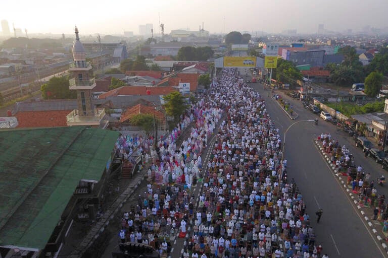 An aerial view shows Muslims praying, marking the end of Ramadan in the celebration of Eid al-Fitr.