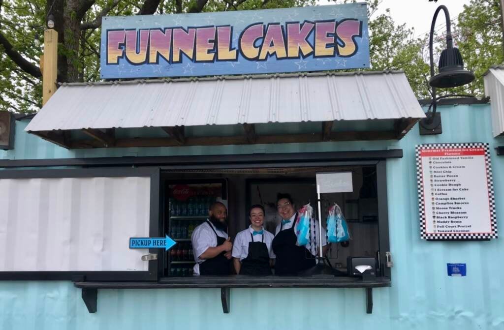 Richard Serano, Destinee Rivera, and Erica Mason work at Frozen Delights, one of the vendors along the boardwalk at Spruce Street Harbor Park.