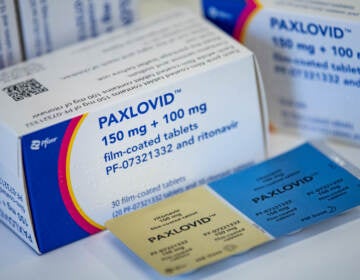 The drug Paxlovid is seen on a table