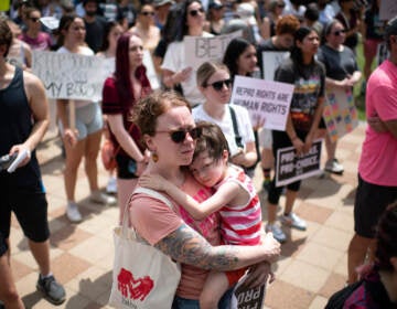 An attendee holds her child during A Texas Rally for Abortion Rights at Discovery Green in Houston, Texas, on May 7. Recently passed laws make abortion illegal after about six weeks into a pregnancy.