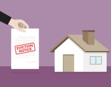 An illustration of a hand holding an eviction notice next to a house