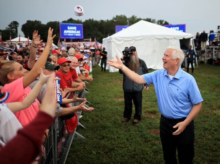 Rep. Mo Brooks greets supporters while campaigning during a 