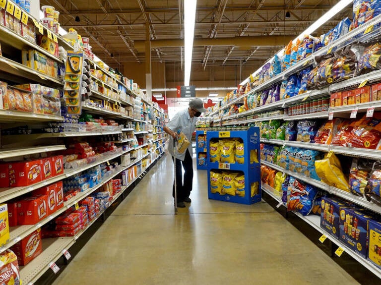 A customer shops at at a grocery store.