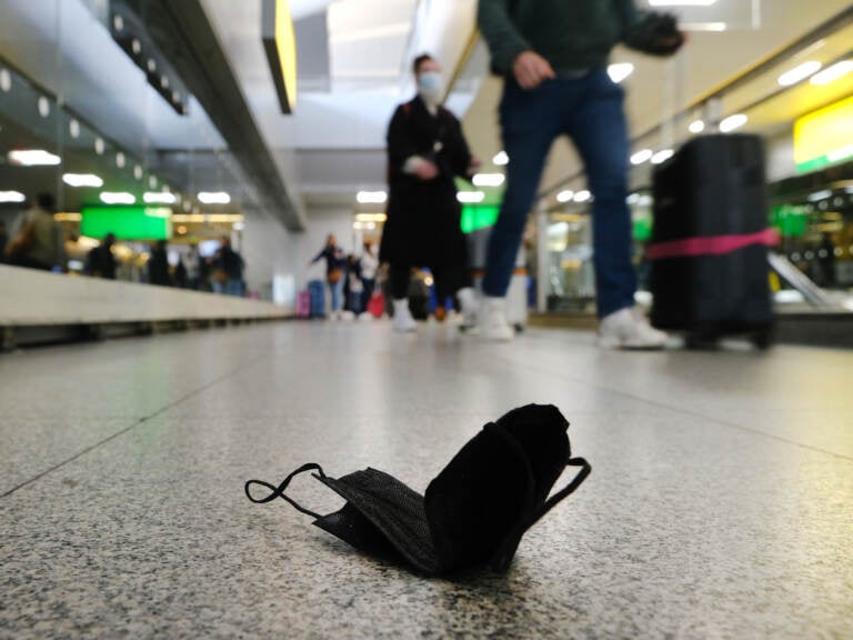 A mask lies on the ground at John F. Kennedy International Airport in New York City on April 19. (Spencer Platt/Getty Images)