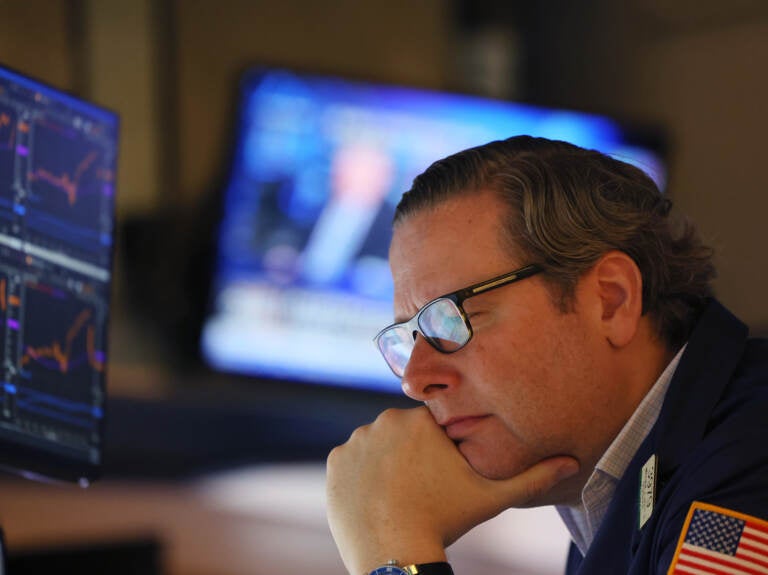 Traders work the floor of the New York Stock Exchange in New York City on Thursday. Stocks fell sharply a day after the Federal Reserve raised interest rates by the most in over two decades. (Michael M. Santiago/Getty Images)
