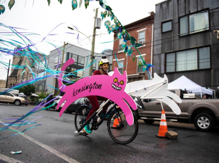 The Kensington Kitty soars through Philadelphia Brewing Company’s ‘Peacock Passage’ obstacle during the race at the Kensington Derby and Arts Festival on Saturday.