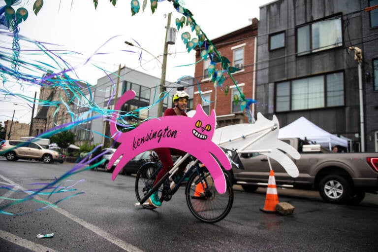 The Kensington Kitty soars through Philadelphia Brewing Company’s ‘Peacock Passage’ obstacle during the race at the Kensington Derby and Arts Festival on Saturday.