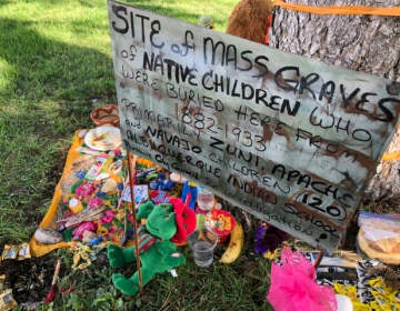 A makeshift memorial under a tree at a public park