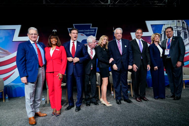 George Bochetto, Kathy Barnette, Mehmet Oz, Jeffrey Lord, Rose Tennent, John Gizzie, Jeff Bartos, Carla Sands, and Lowman Henry pose for a photograph during a forum for Republican candidates for U.S. Senate in Pennsylvania