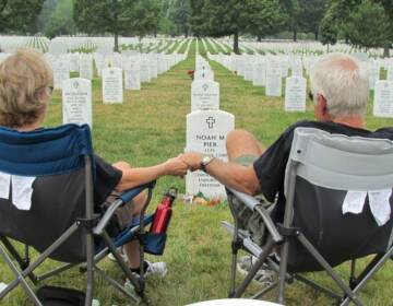 Vikki and Mark Pier visit the grave of their son, Noah, who was buried at Arlington National Cemetery in July 2011. They used to visit every few months, but they have been unable to make it in recent years. (Erin Stalnaker)